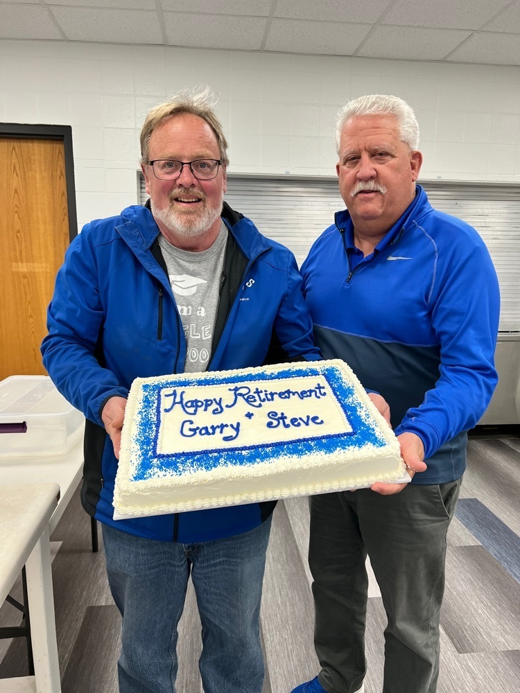 Steve Clark and Garry Leuning with retirement cake